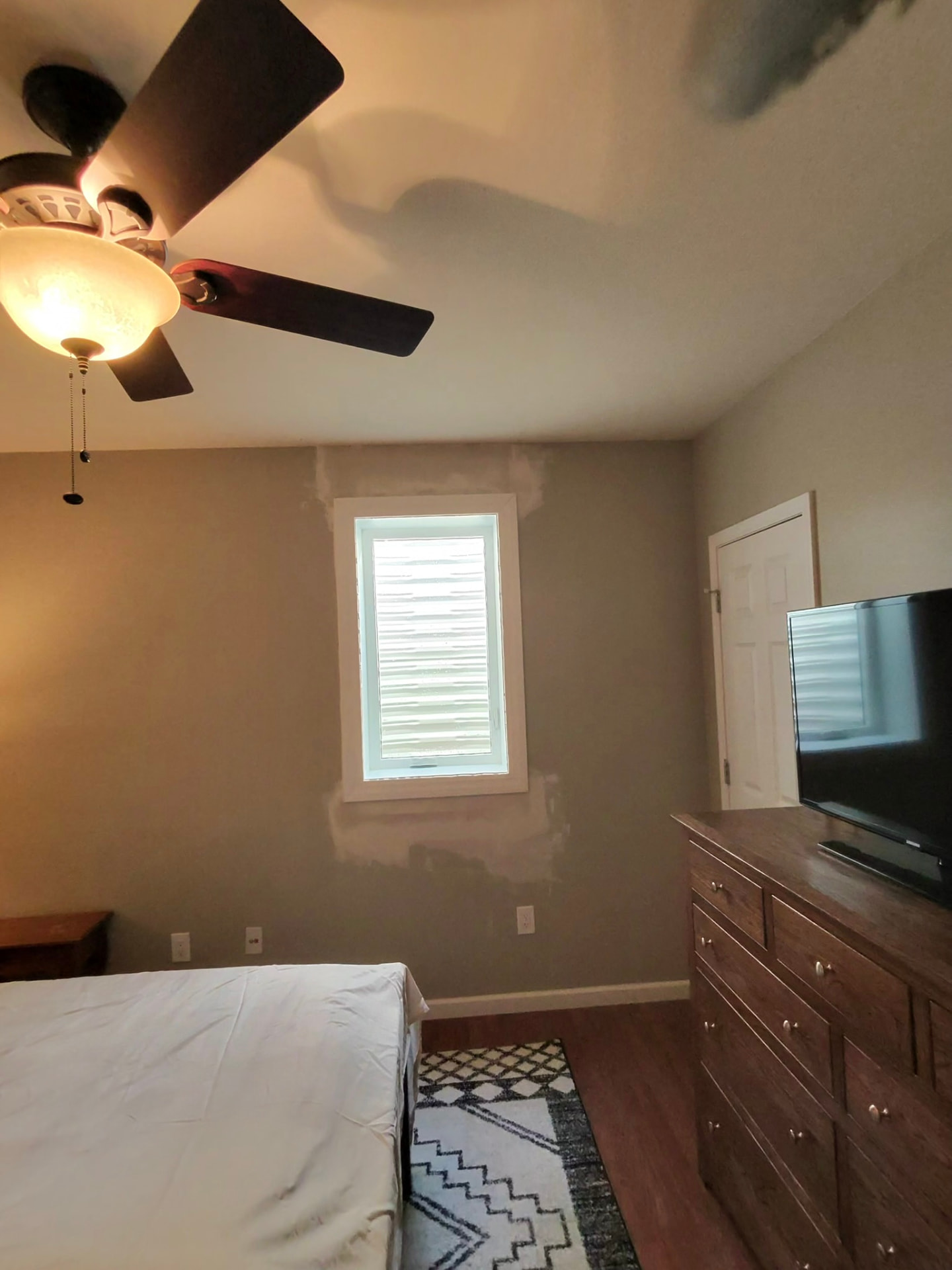 Finished casement egress window with trim in a bedroom, room left undisturbed, Godfrey, Illinois, GHR Egress Windows.